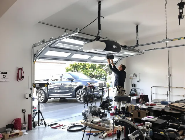 Stoneham Garage Door Repair specialist installing smart garage door opener system in Stoneham home