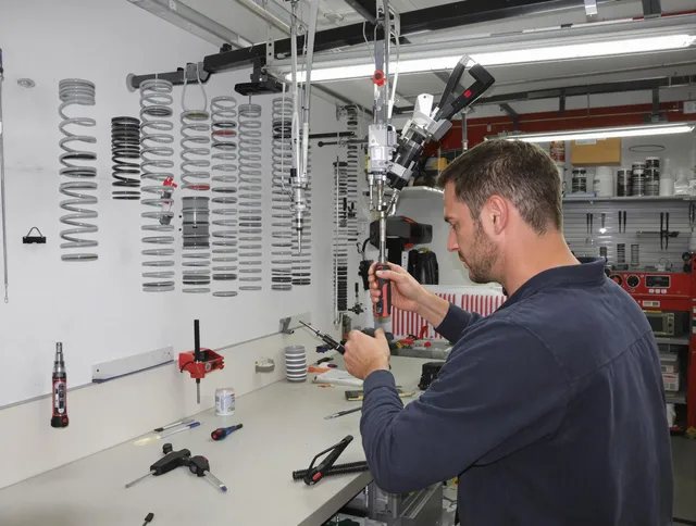 Stoneham Garage Door Repair safety certified technician performing precision spring replacement in Stoneham