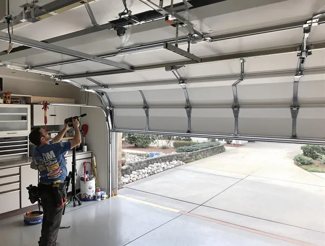 Garage door track repair service by Stoneham Garage Door Repair in Stoneham